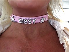 This sissy slut video features a submissive crossdresser exploring their femininity and gett...