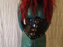 A latex-clad redhead shemale is the star of this amateur solo video, as she vibrates and mas...