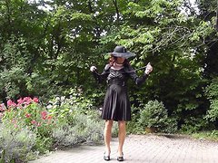 A crossdressing slut in satin and nylon stockings masturbates in public while showing off he...